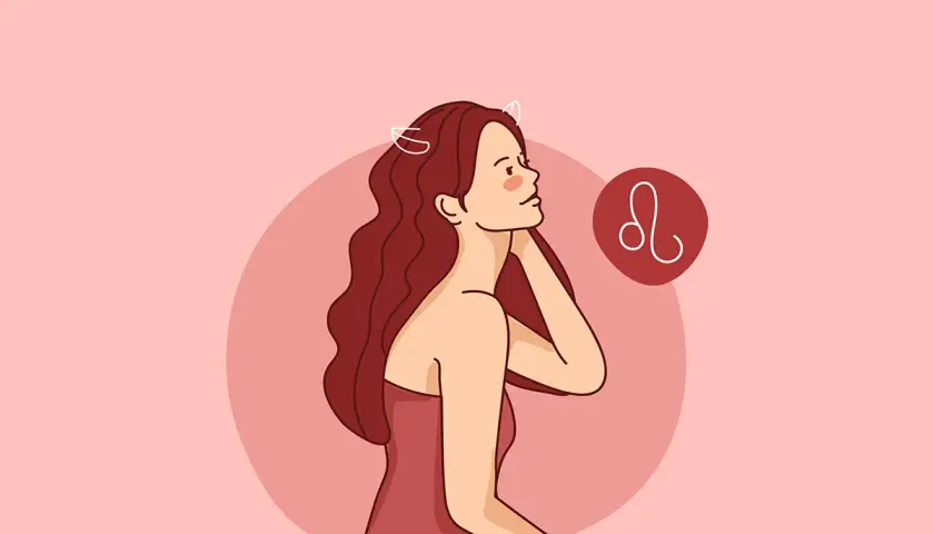 Kobieta lew z burzą rudych włosów i symbolem zodiaku.