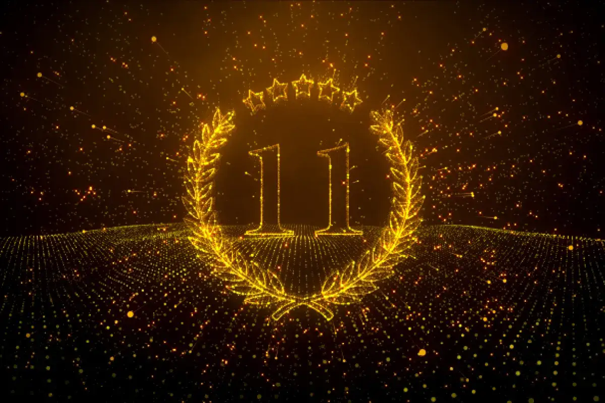 Złoty wieniec laurowy z liczbą 11 i gwiazdkami. Symbolizuje moc numerologiczna 11 mężczyzna, kt&oacute;ry dąży do celu.